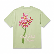 T-shirt Global Sneakers Concrete Bloom en coton premium 230 g fabriqué au Portugal, avec illustration florale signature sur la poitrine et dans le dos, disponible en Noir, Blanc, Lila et Verdeau.