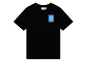 Tee-shirt Casablanca Porte bleue noir en coton avec imprimé coloré représentant une porte bleue dans un décor au coucher du soleil.