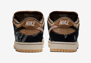 Sneakers Nike SB Dunk Low Travis Scott en suède, cuir et toile, coloris beige, marron et noir, swoosh inversé et détails premium.