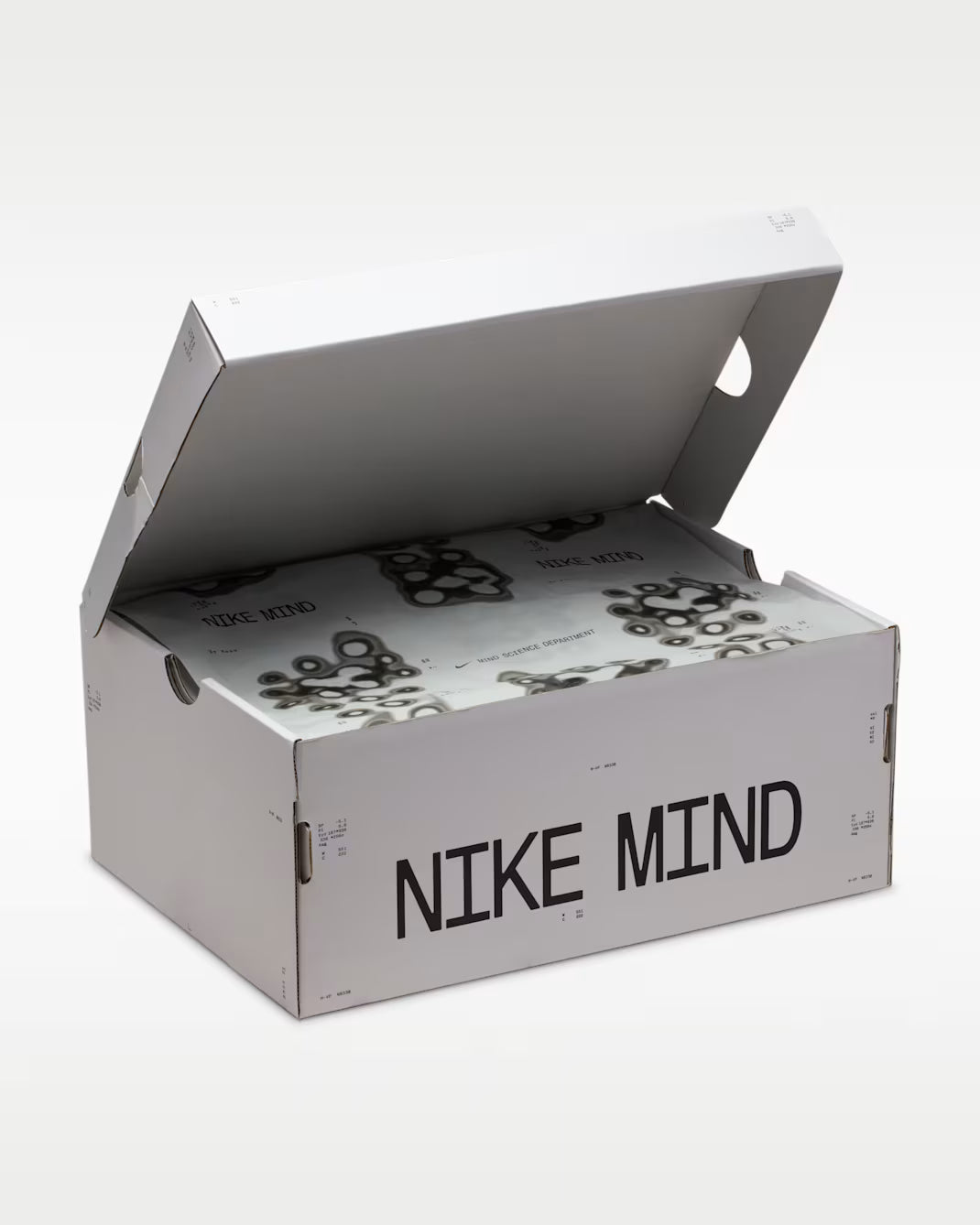 Nike Mind 002 Football Grey en mousse technique grise avec semelle sculptée ergonomique et confort sensoriel innovant.
