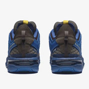 Salomon ACS Pro A-COLD-WALL Bluing Earth Brown avec tige en mesh technique respirant, cage synthétique structurée, système Quicklace™ et semelle extérieure Contagrip® vue de derrière. 
