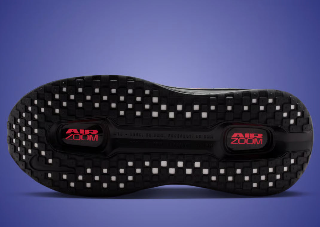 Sneakers Nike Vomero Premium femme en Black, Sapphire et Rose avec mesh respirant et amorti Zoom Air premium.