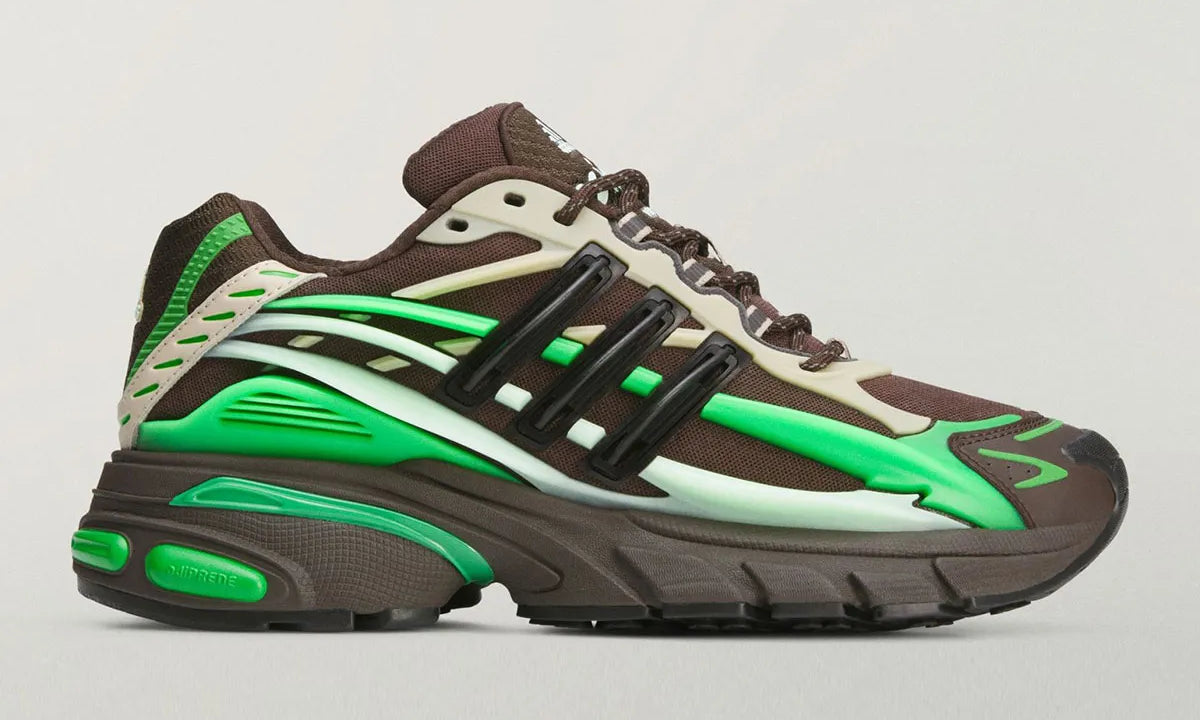 Adidas Adistar Jellyfish Pharrell Williams Brown Green KK2888 avec silhouette running sculpturale, base marron et accents verts.