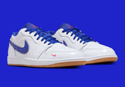 Sneakers Air Jordan 1 Low SE en cuir et suède, coloris bleu Dodgers et blanc, détails brodés signature et design lifestyle premium.