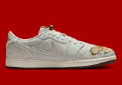 Sneakers Air Jordan 1 Retro Low OG en cuir premium avec détails brodés inspirés du Nouvel An chinois, coloris rouge et accents dorés, édition collector 2026.

