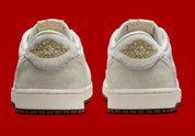 Sneakers Air Jordan 1 Retro Low OG en cuir premium avec détails brodés inspirés du Nouvel An chinois, coloris rouge et accents dorés, édition collector 2026.


