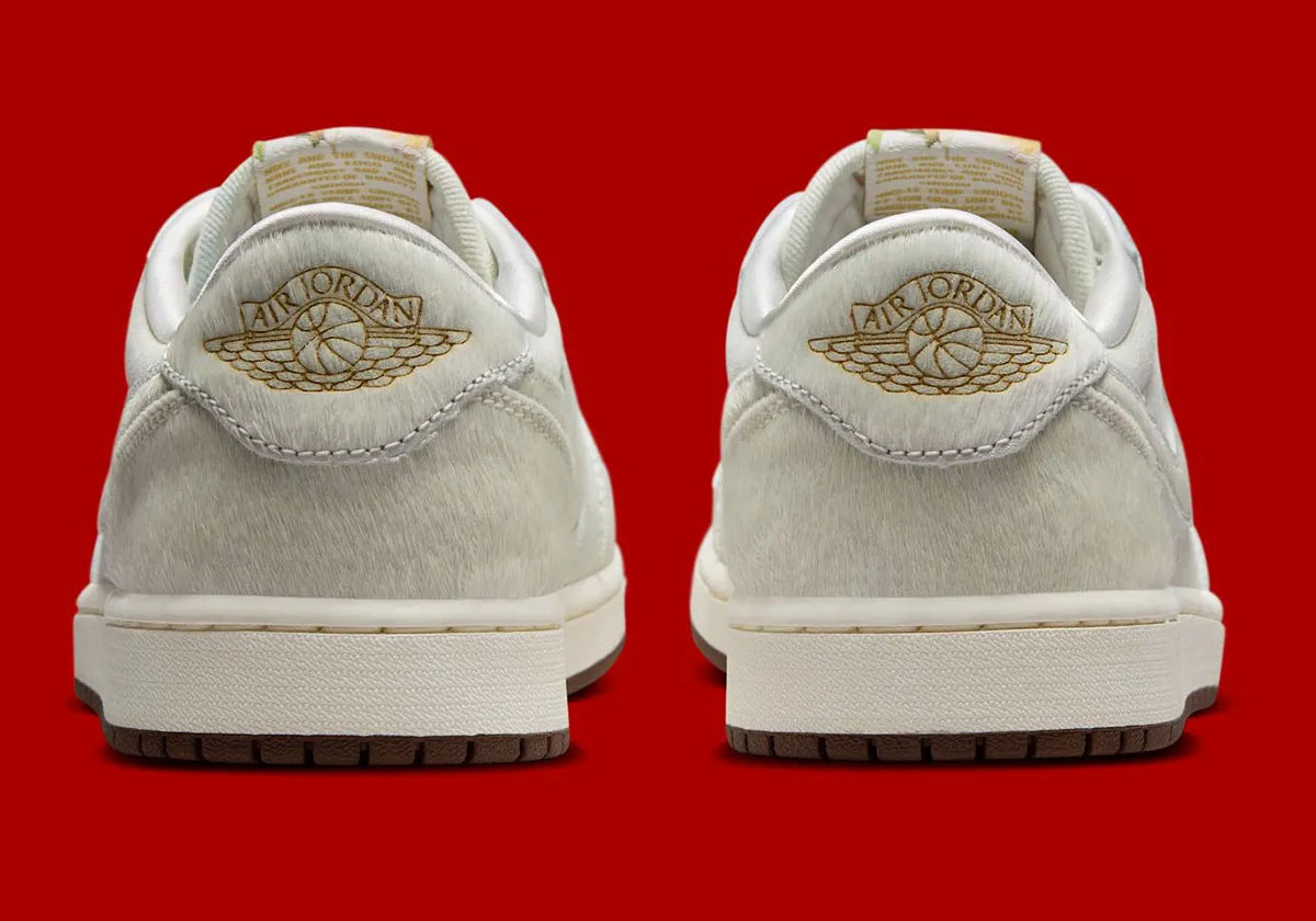 Sneakers Air Jordan 1 Retro Low OG en cuir premium avec détails brodés inspirés du Nouvel An chinois, coloris rouge et accents dorés, édition collector 2026.

