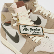 Air Jordan 1 Retro High OG Khaki, sneaker montante Jordan Brand en coloris kaki avec design iconique, amorti confortable et finitions premium.