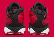 Air Jordan 13 Retro Low Very Berry (TD) en coloris Black/Very Berry-White, avec base noire et détails Very Berry.