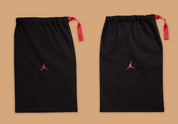 Air Jordan 3 Retro PRM Bin23 en cuir premium brun avec sceau rouge Bin23 et amorti Air visible emblématique.
