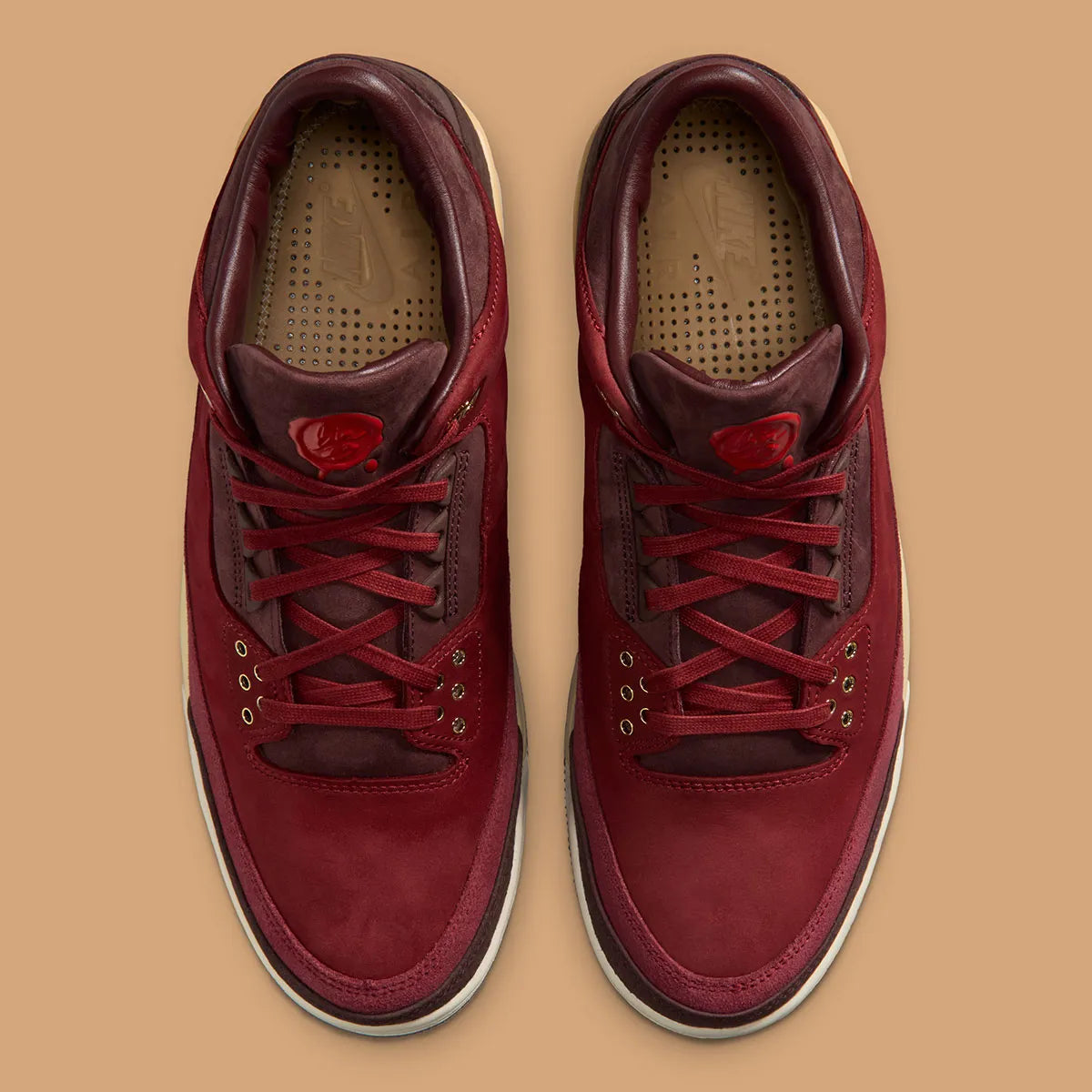 Air Jordan 3 Retro PRM Bin23 en cuir premium brun avec sceau rouge Bin23 et amorti Air visible emblématique.

