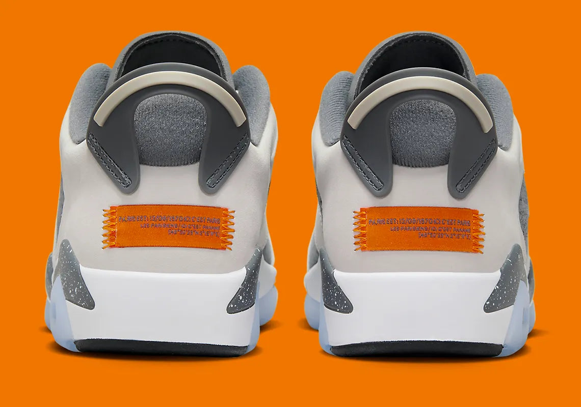 Air Jordan 6 Retro Low PSG 2023 DZ4133-008 en Light Bone et Iron Grey avec accents Magma Orange, semelle mouchetée et outsole translucide.