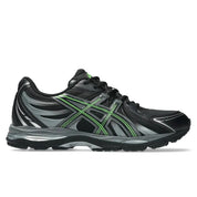ASICS Gel-Sekiran Black Silver Green en mesh noir avec détails argentés et verts, amorti GEL et silhouette technique contemporaine.