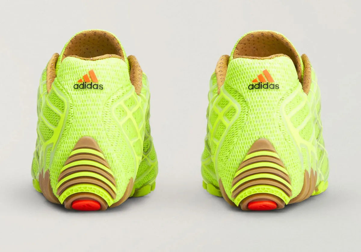 Adidas F50 Ghost Sprint Bad Bunny Solar Slime avec tige textile jaune-vert Solar Slime, détails noirs, motif inspiré de la F50 Spider et semelle extérieure en caoutchouc.