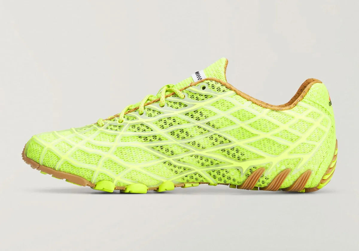 Adidas F50 Ghost Sprint Bad Bunny Solar Slime avec tige textile jaune-vert Solar Slime, détails noirs, motif inspiré de la F50 Spider et semelle extérieure en caoutchouc.
