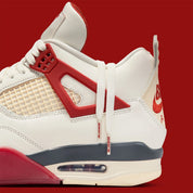 Sneaker Air Jordan 4 Nigel Sylvester Brick By Brick rouge brique en suède premium avec semelle Air visible et détails OG iconiques.