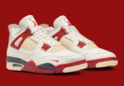Sneaker Air Jordan 4 Nigel Sylvester Brick By Brick rouge brique en suède premium avec semelle Air visible et détails OG iconiques.