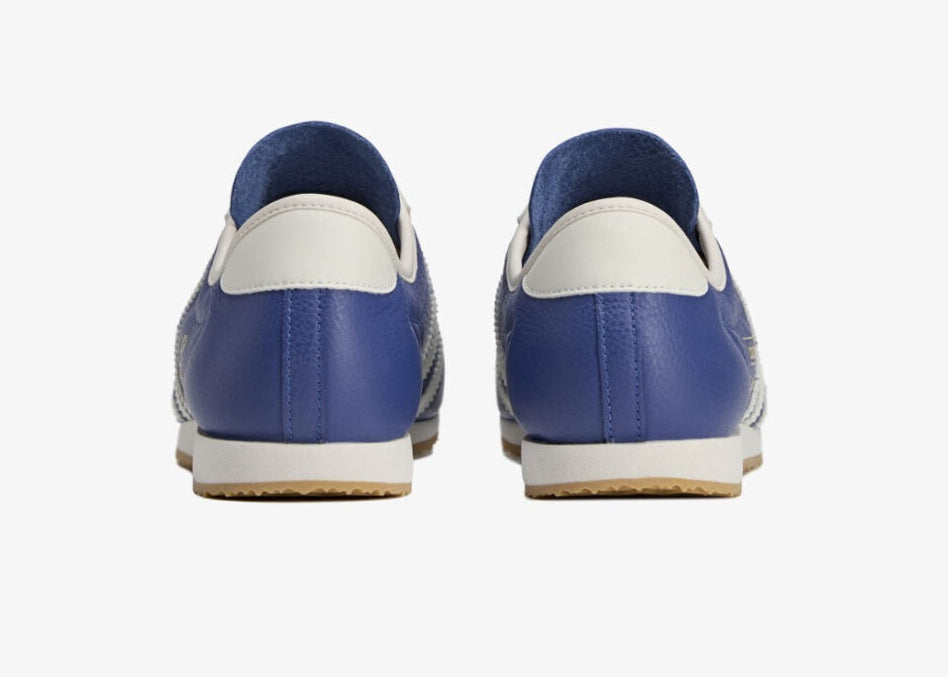 Sneakers adidas Italia SPZL C.P. Company Collegiate Royal en matériaux premium avec détails collaboratifs et semelle fine confortable vue de derrière. 