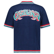 Casablanca Gothic Short Sleeve Crochet Shirt Navy, chemise Casablanca bleu marine à manches courtes avec construction en crochet ajouré et détails Gothic.