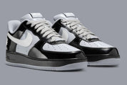 Sneakers Nike Air Force 1 Low en cuir premium, coloris Black White Smoke Grey avec détails Central Cee signature et amorti Air encapsulé.