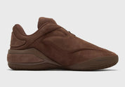 Converse SHAI 001 Lux Truffle, sneaker de basketball marron en nubuck premium avec empeigne sculptée, fermeture zippée et semelle technique.