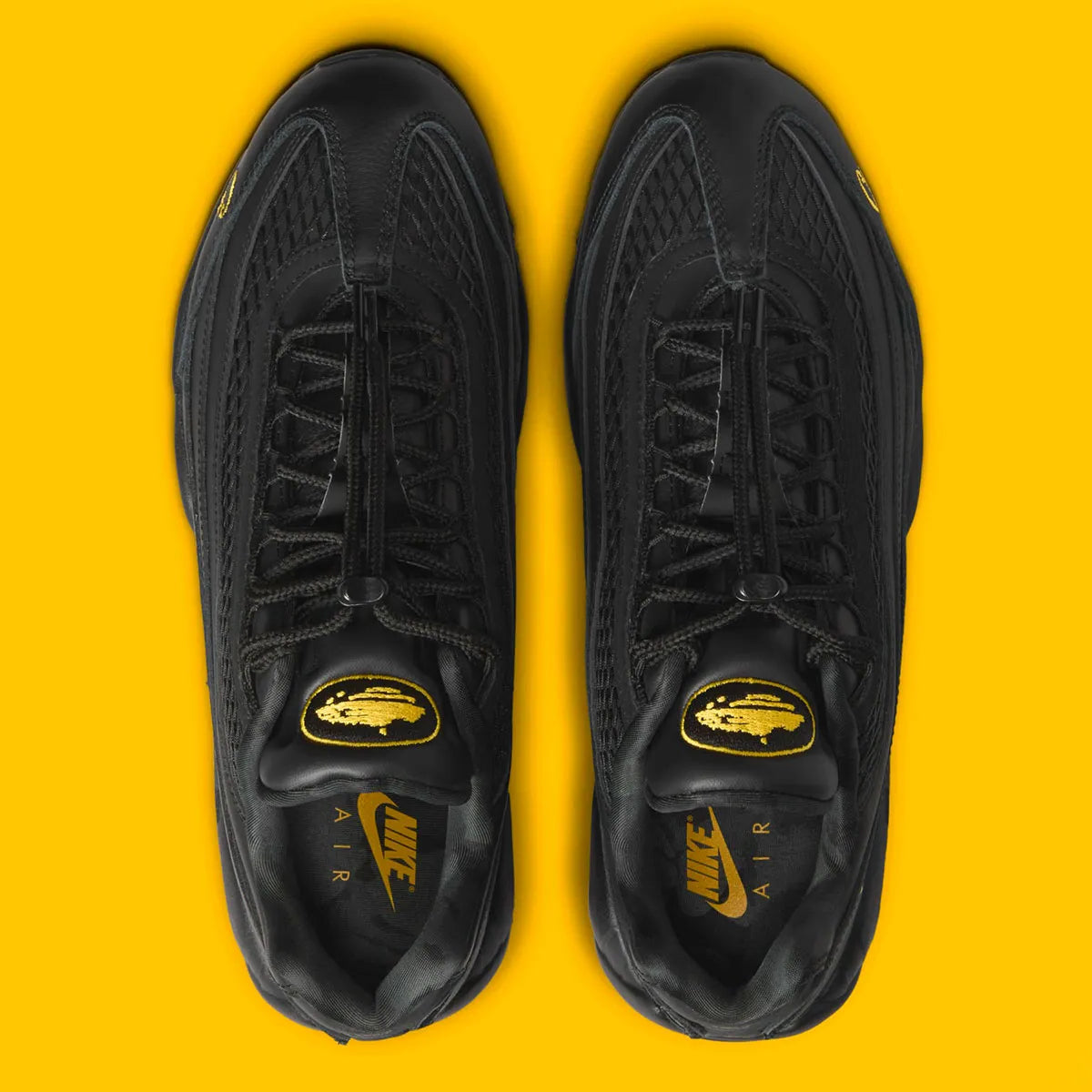 Nike Air Max 95 Corteiz Honey Black noire en cuir et mesh diamant avec détails Corteiz, logo Alcatraz et unités Air Max Tour Yellow vue du dessus. 