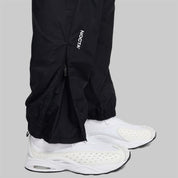 Nike x NOCTA Drake Northstar Nylon Track Pants Anthracite Grey, pantalon de survêtement en nylon gris anthracite avec poches zippées et logos NOCTA.