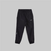 Nike x NOCTA Drake Northstar Nylon Track Pants Anthracite Grey, pantalon de survêtement en nylon gris anthracite avec poches zippées et logos NOCTA.