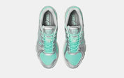 Sneaker ASICS Gel-Kayano 12.1 Ice Green Gravel en mesh vert glacé avec détails gris pierre, amorti GEL et silhouette rétro-running technique.