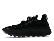 Nike Mind 002 Flyknit Fragment Black en maille Flyknit noire avec semelle sculptée ergonomique et détails signature Fragment Design.