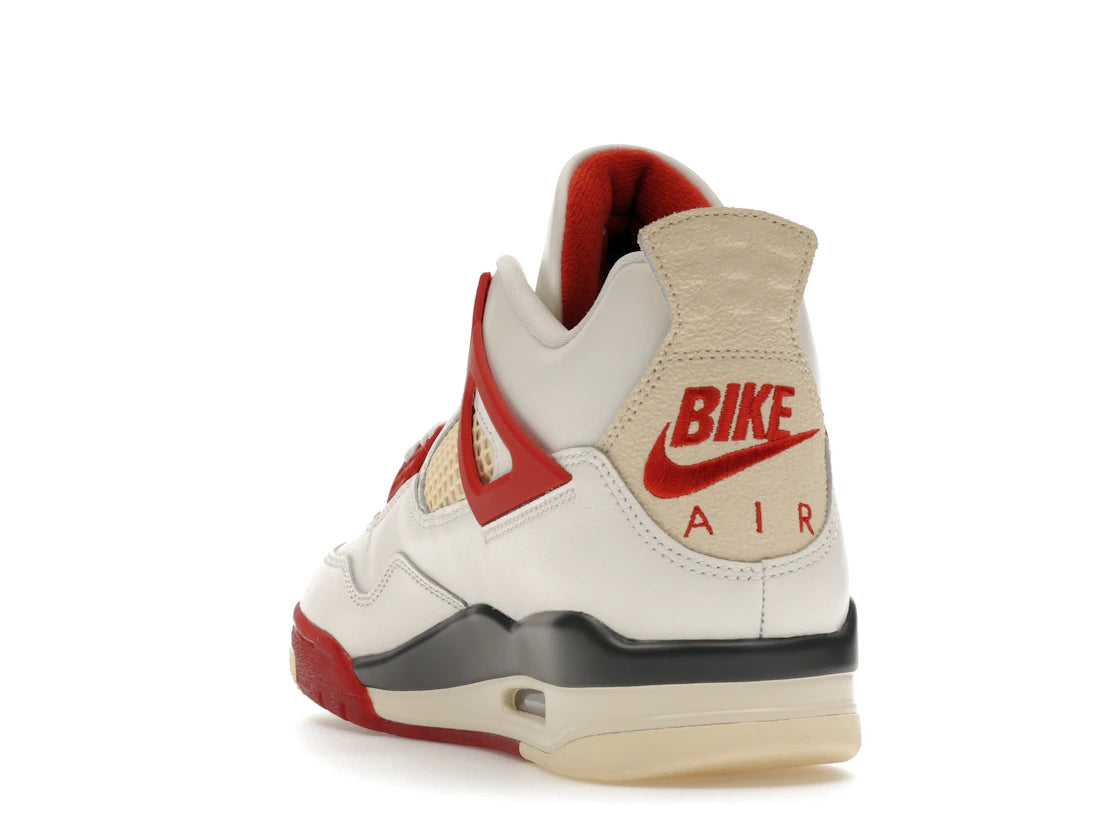 Sneaker Air Jordan 4 Nigel Sylvester Brick By Brick rouge brique en suède premium avec semelle Air visible et détails OG iconiques.