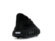 Nike Mind 002 Flyknit Fragment Black en maille Flyknit noire avec semelle sculptée ergonomique et détails signature Fragment Design.