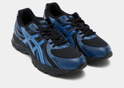 ASICS Gel-Sekiran Black Polar Night en mesh noir avec détails bleu nuit, amorti GEL et silhouette technique contemporaine.