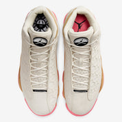 Air Jordan 13 Retro Chinese New Year 2020 CW4409-100 en cuir et suède Pale Ivory, avec motifs de pièces chinoises et semelle Digital Pink.