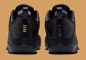 Sneaker Nike Kobe 11 Elite Low Protro noire avec détails dorés en Flyknit et semelle performance React et Air Zoom iconique