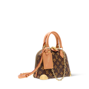 Louis Vuitton Alma Trunk BB, sac en toile Monogram marron avec cuir noir, coins métalliques dorés, cadenas et chaîne amovible.