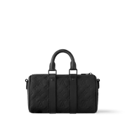 Louis Vuitton Keepall Bandoulière 25 Monogram Embossed Black en cuir de veau grainé embossé Monogram noir avec poignées roulées, bandoulière amovible, fermeture zippée et finitions métalliques.