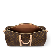 Louis Vuitton Keepall Bandoulière Monogram 55 Brown en toile Monogram marron avec garnitures en cuir naturel, poignées roulées, bandoulière réglable et amovible, fermeture zippée à double curseur et finitions métalliques.