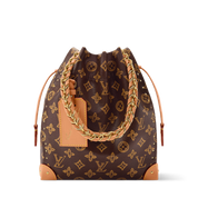 Louis Vuitton Noe Trunk, sac seau en toile Monogram marron avec cuir, coins métalliques dorés, chaîne tressée et cordon coulissant.