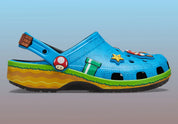 Crocs Classic Clog Super Mario Bros. Super Mario en résine Croslite™ avec Jibbitz™ Mario, Étoile, Super Champignon, blocs « ? », pièces et bride pivotante sur semelle antidérapante.