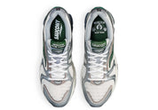 Saucony ProGrid Triumph 4 Minted NY en mesh blanc avec accents mint et amorti ProGrid.
