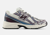  chaussure de sport new balance 740 blanche et bleu , semelle légère , vu de profil
