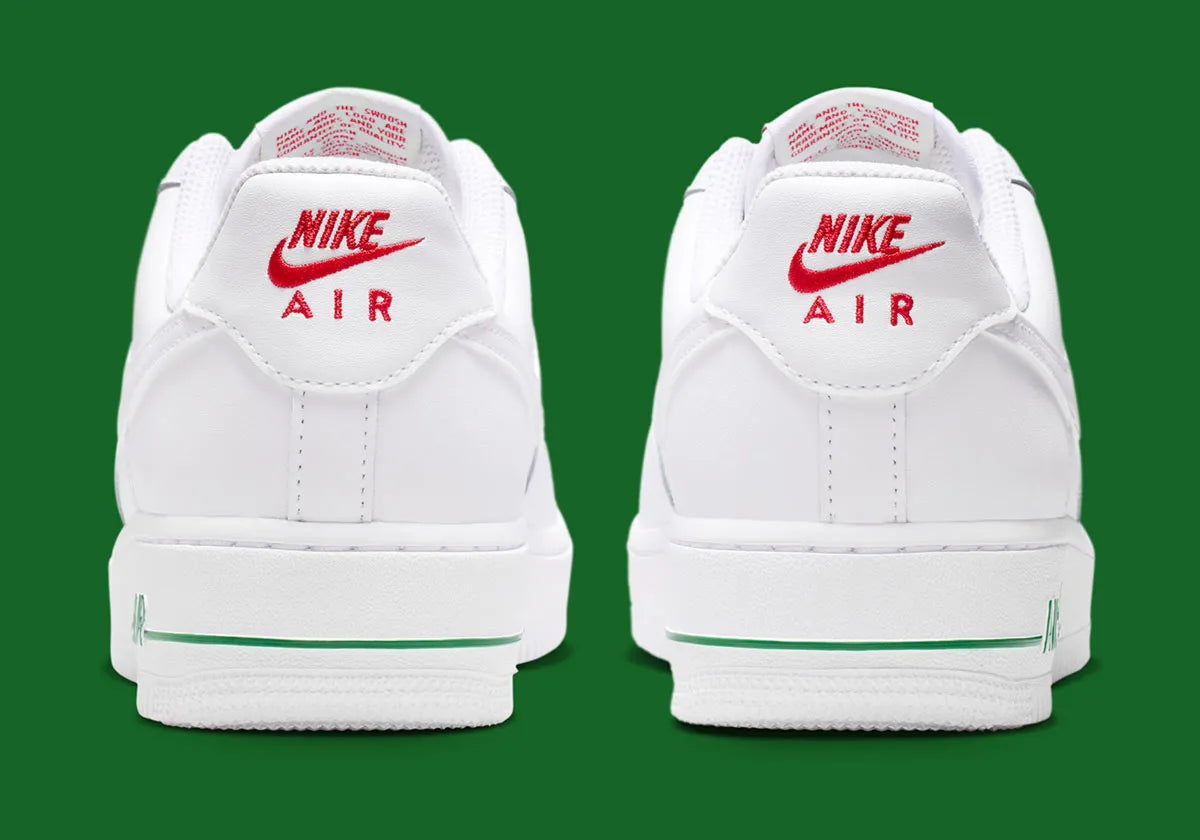 Nike Air Force 1 Low blanche et rose en cuir premium avec semelle Nike Air et détails floraux raffinés. vue de derrière