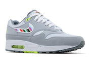 Nike Air Max 1 Ducks of a Feather Oregon Ducks Tokyo JF4580-001 en mesh et suède gris avec Swoosh multicolore, détails verts et branding japonais.