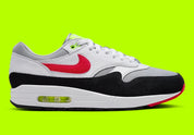 Nike Air Max 1 Chili Volt, sneaker Nike Air Max 1 avec coloris Chili et Volt, amorti Nike Air visible et finitions premium.
