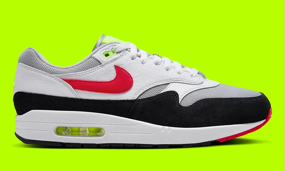 Nike Air Max 1 Chili Volt, sneaker Nike Air Max 1 avec coloris Chili et Volt, amorti Nike Air visible et finitions premium.