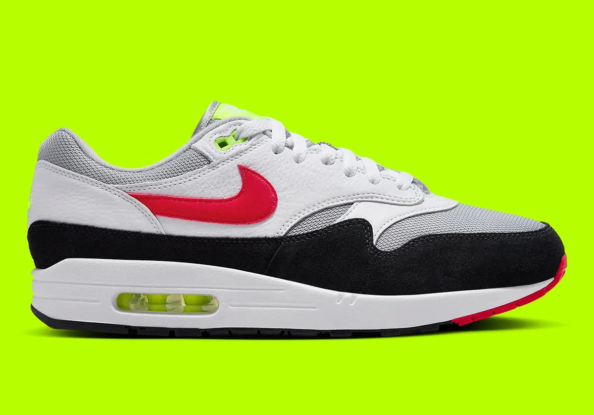 Nike Air Max 1 Chili Volt, sneaker Nike Air Max 1 avec coloris Chili et Volt, amorti Nike Air visible et finitions premium.