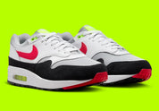 Nike Air Max 1 Chili Volt, sneaker Nike Air Max 1 avec coloris Chili et Volt, amorti Nike Air visible et finitions premium.