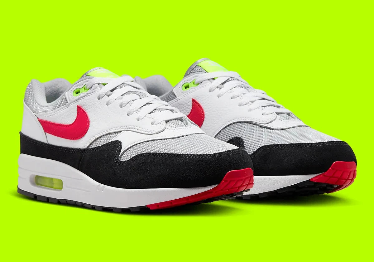 Nike Air Max 1 Chili Volt, sneaker Nike Air Max 1 avec coloris Chili et Volt, amorti Nike Air visible et finitions premium.