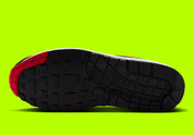 Nike Air Max 1 Chili Volt, sneaker Nike Air Max 1 avec coloris Chili et Volt, amorti Nike Air visible et finitions premium.
